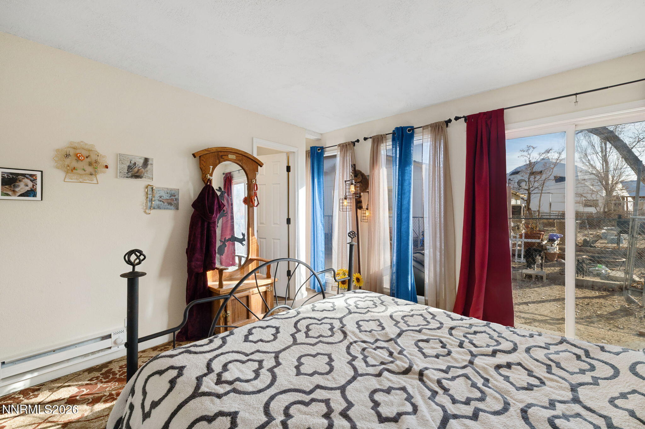 145 K Street Hawthorne, NV 89415 - Photo 14 of 25 a bedroom with a bed and a large mirror