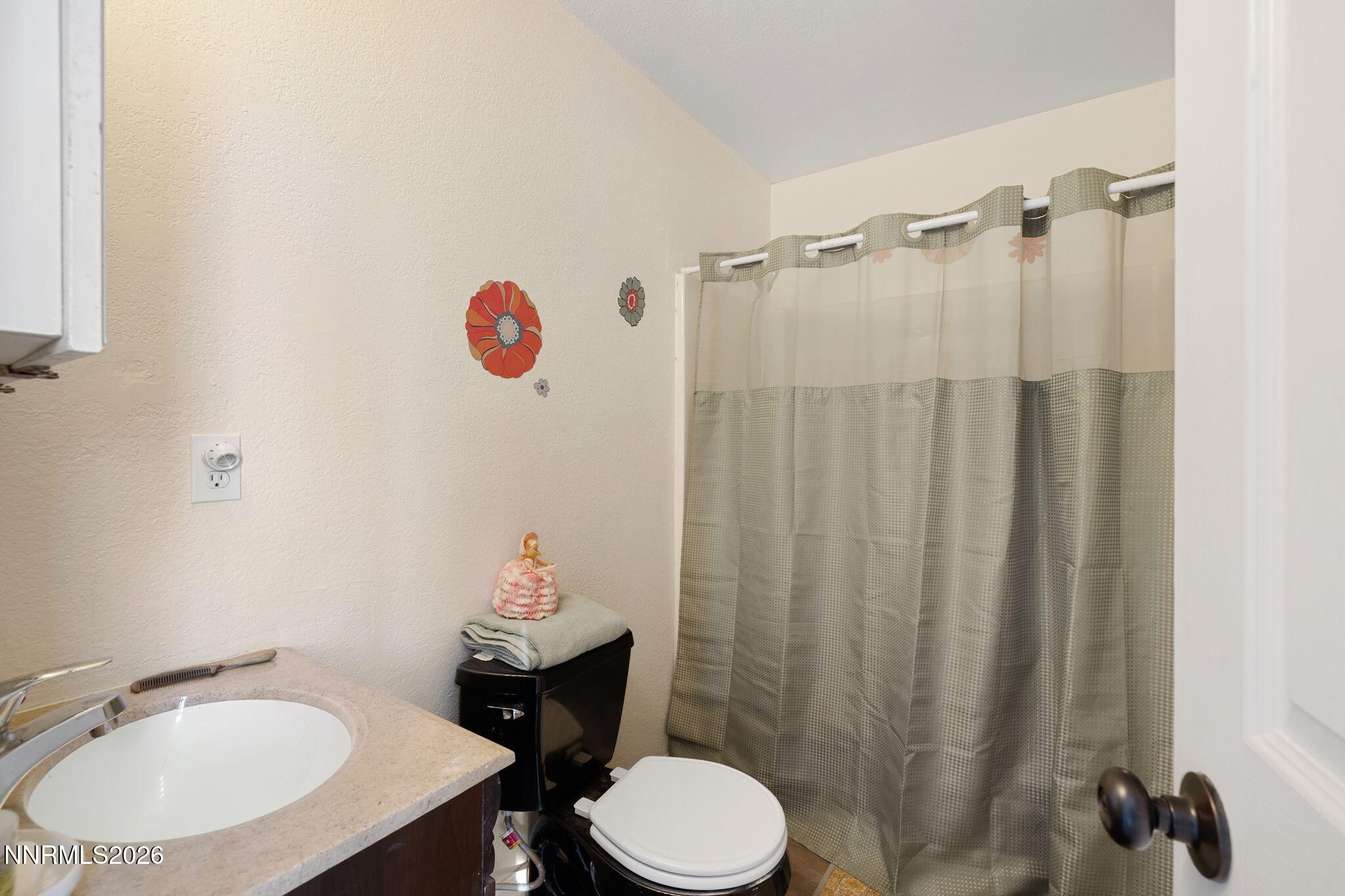 145 K Street Hawthorne, NV 89415 - Photo 16 of 25 a bathroom with a sink toilet and shower