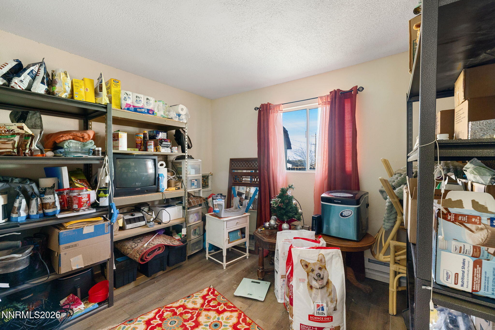 145 K Street Hawthorne, NV 89415 - Photo 18 of 25 a room with furniture and a book shelf
