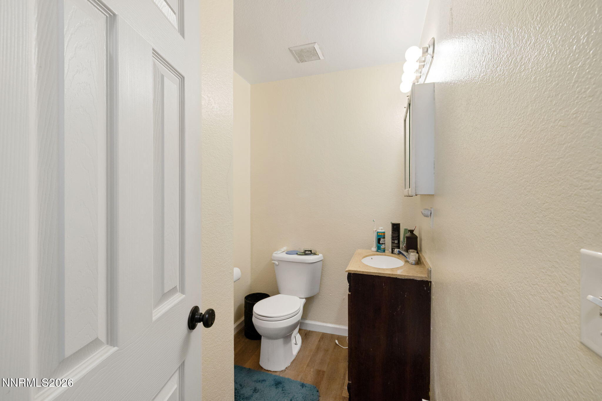 145 K Street Hawthorne, NV 89415 - Photo 19 of 25 a bathroom with a toilet and a mirror