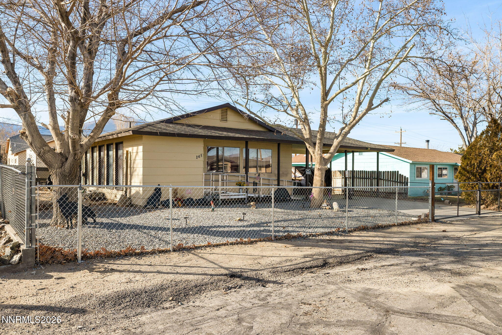 145 K Street Hawthorne, NV 89415 - Photo 2 of 25 a front view of a house with garden