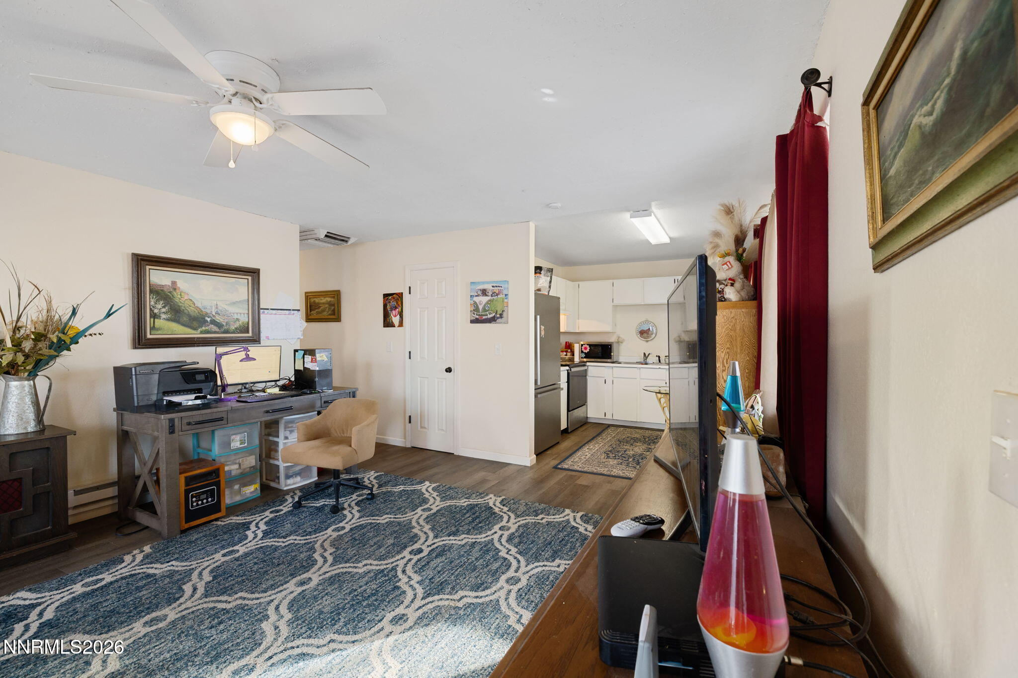 145 K Street Hawthorne, NV 89415 - Photo 7 of 25 a view of a workspace with furniture and a window