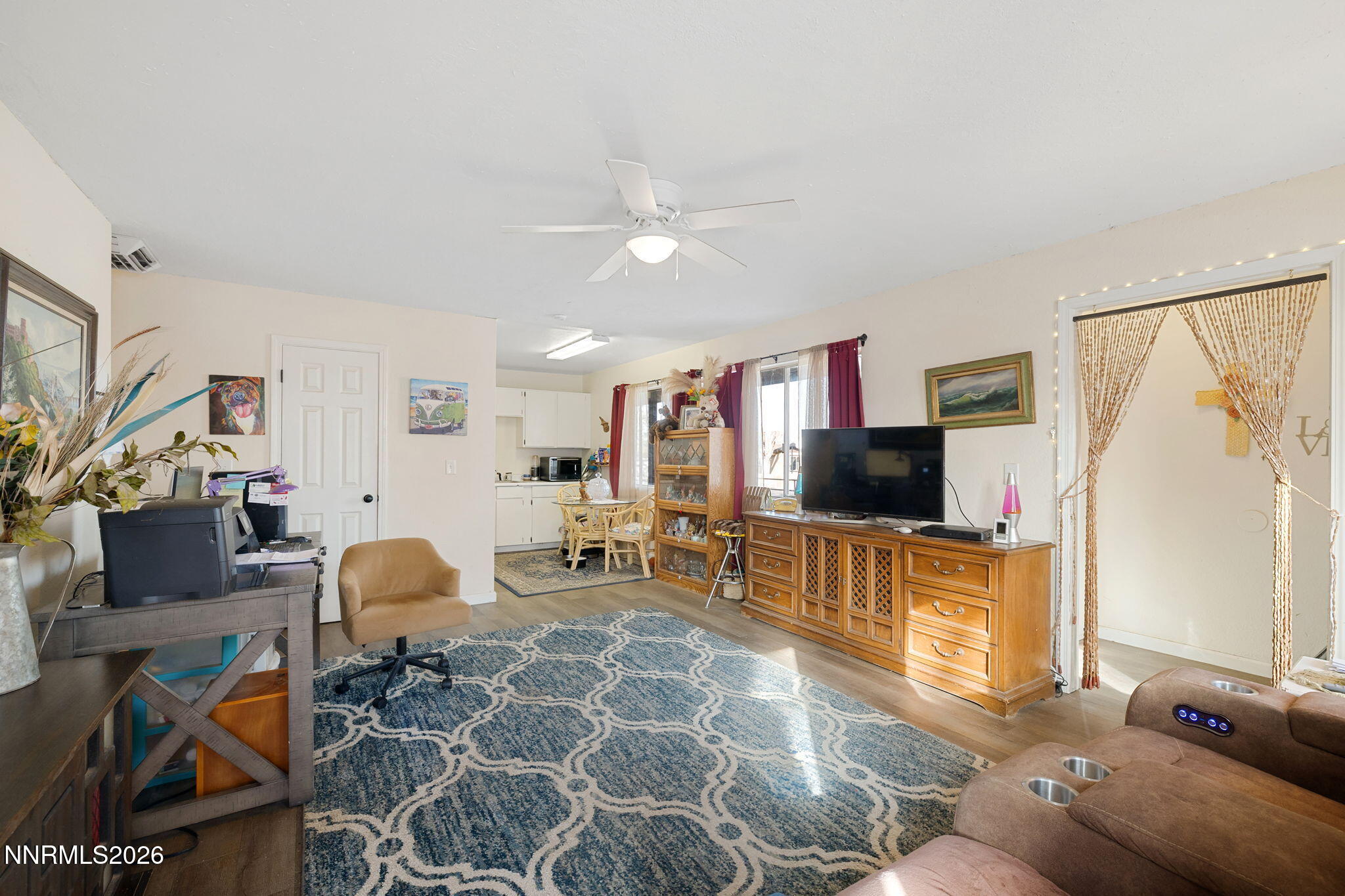 145 K Street Hawthorne, NV 89415 - Photo 10 of 25 a living room with furniture and a flat screen tv