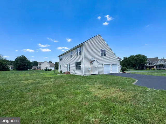 a view of a house with a big yard