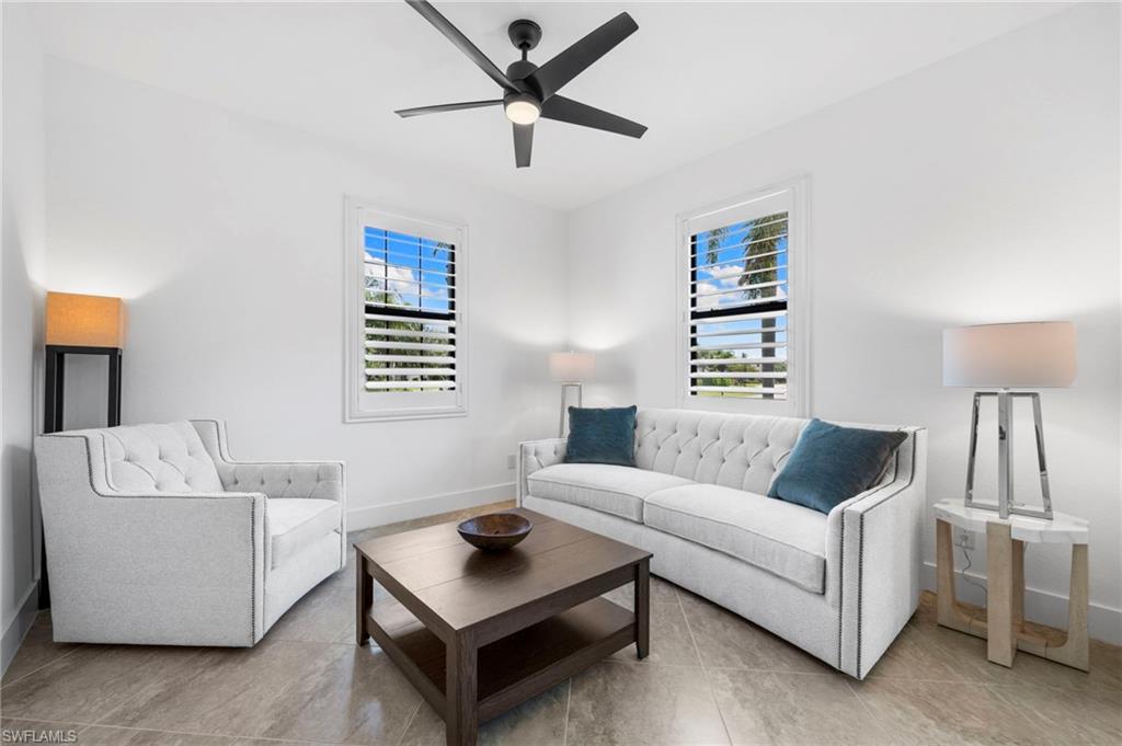 4764 Formosa Drive Naples, FL 34119 - Photo 12 of 32 a living room with furniture and a window
