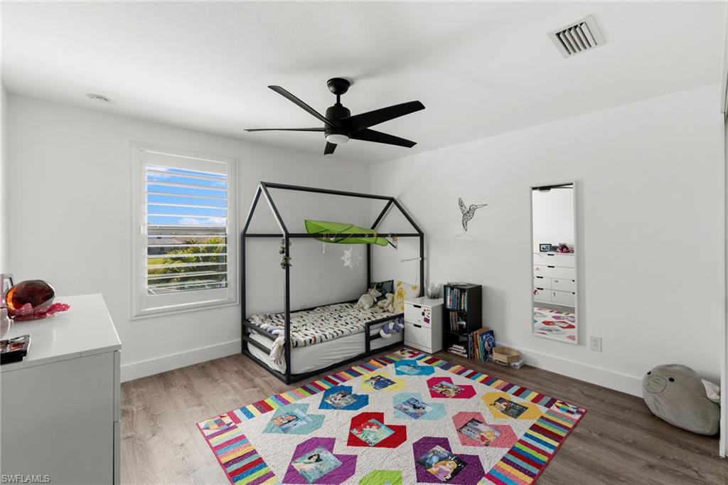 4764 Formosa Drive Naples, FL 34119 - Photo 21 of 32 a bedroom with furniture and a window