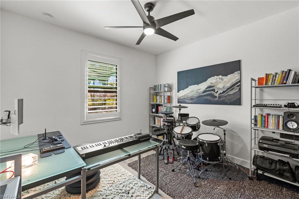 4764 Formosa Drive Naples, FL 34119 - Photo 23 of 32 a living room with furniture a air conditioner and a window