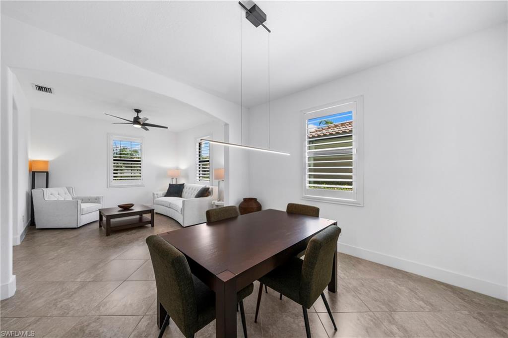 4764 Formosa Drive Naples, FL 34119 - Photo 9 of 32 a living room with furniture and a window