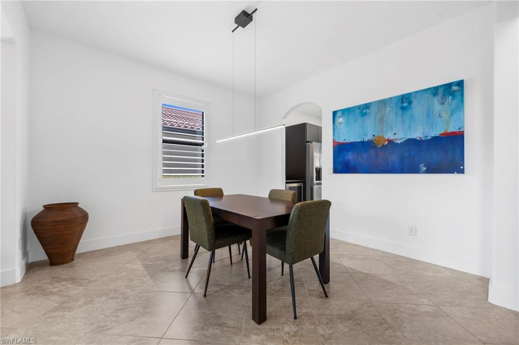 4764 Formosa Drive Naples, FL 34119 - Photo 10 of 32 a workspace with furniture and a window