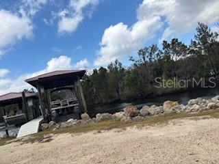 6185 South Hancock Road Homosassa, FL 34448 - Photo 9 of 9 a view of a backyard of the house