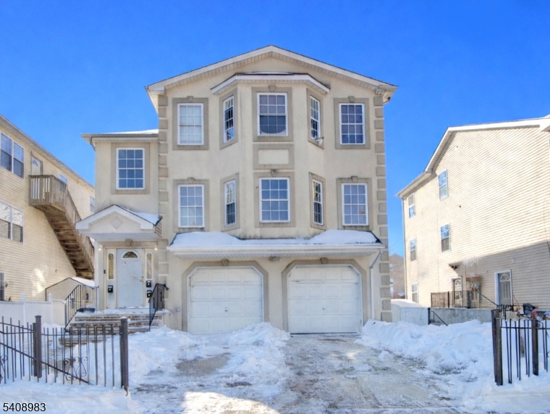 91 William Street East Orange, NJ 07017 - Photo 1 of 10 a front view of a building with many windows