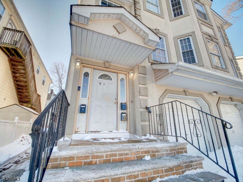 91 William Street East Orange, NJ 07017 - Photo 2 of 10 a view of a entryway with staircase