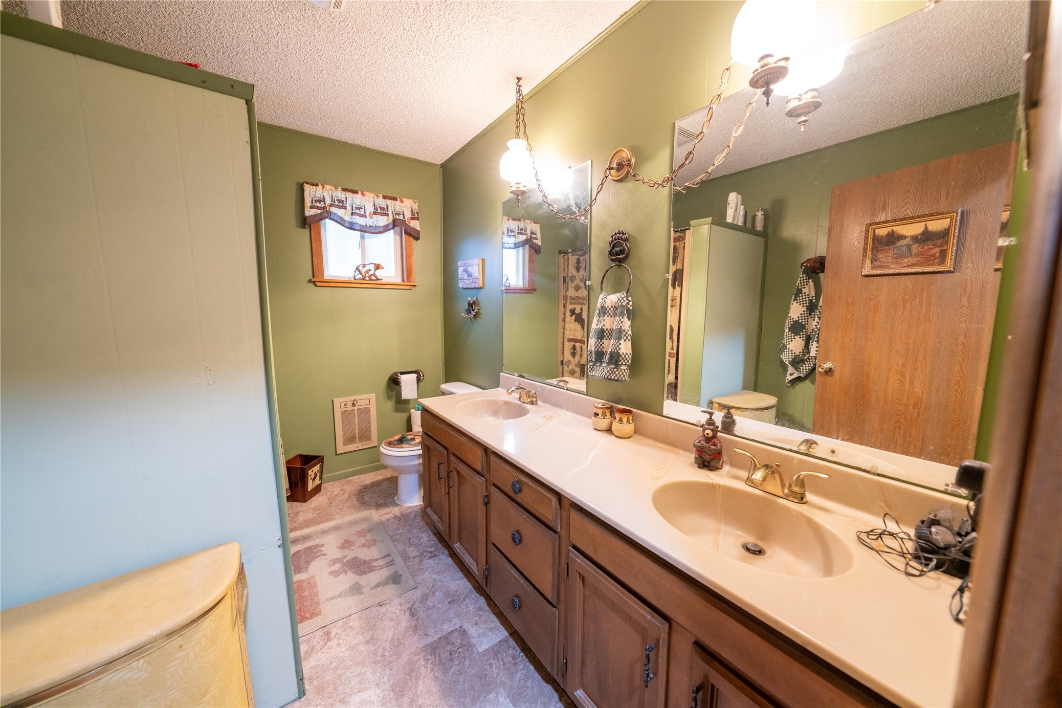644 Waterfront Road Troy, MT 59935 - Photo 51 of 66 Full bathroom with a textured ceiling and double vanity
