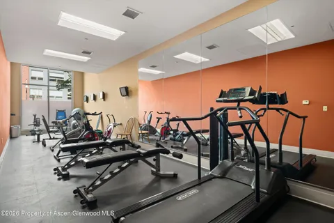 a view of a room with gym equipment