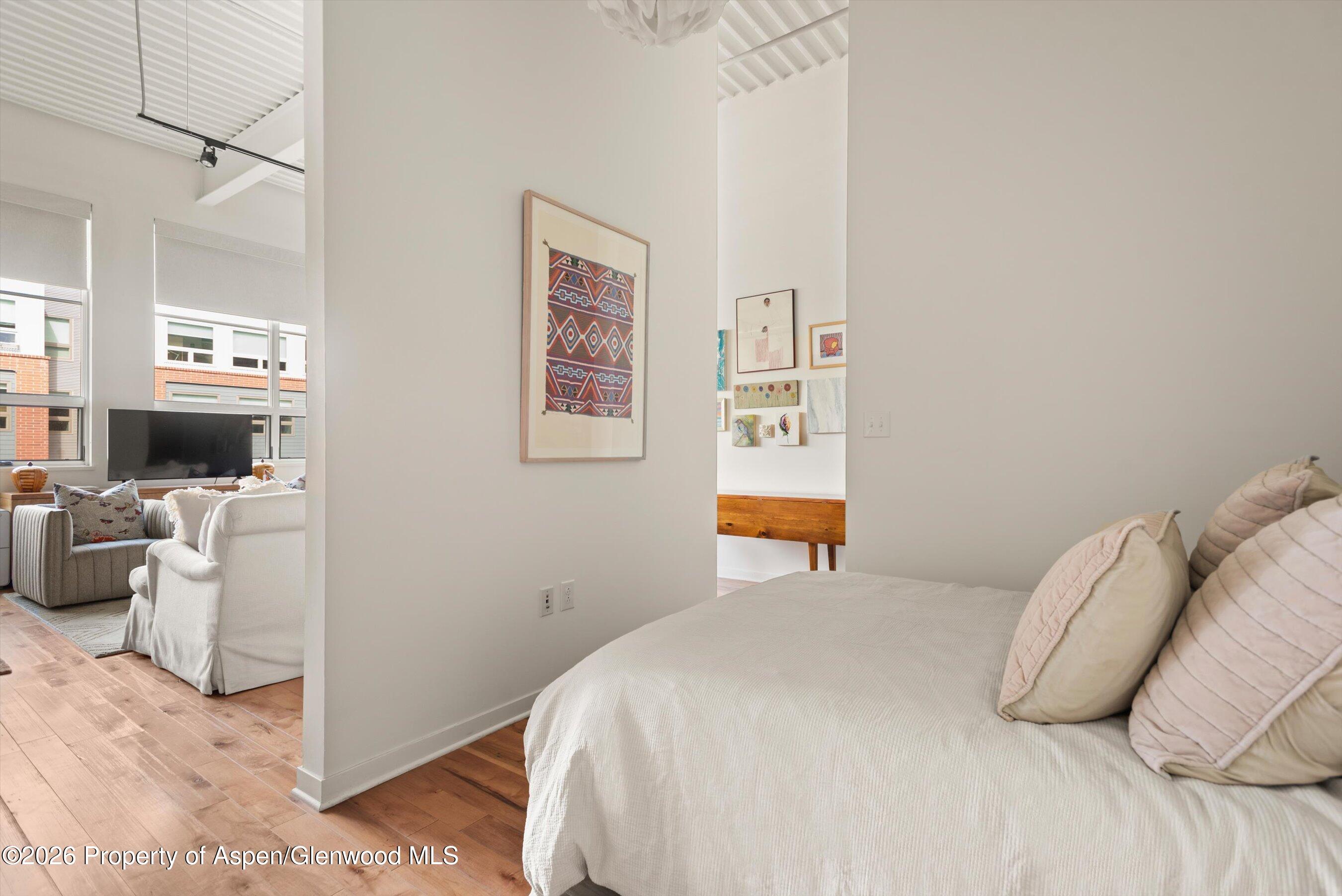 361 Robinson Street, Unit 240 Basalt, CO 81621 - Photo 5 of 11 a bedroom with a bed and a couch
