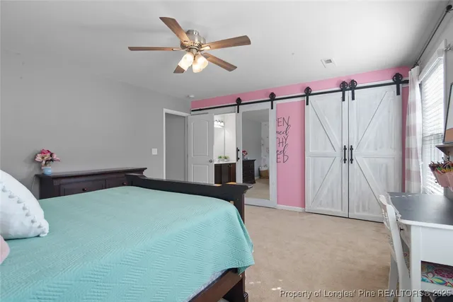 a bedroom with a bed and a mirror