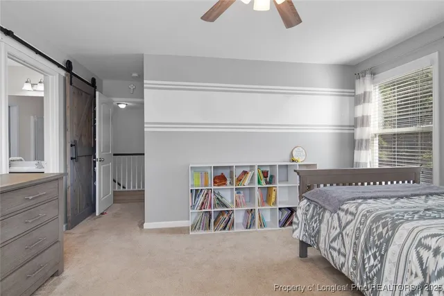 a bedroom with a bed and a book shelf