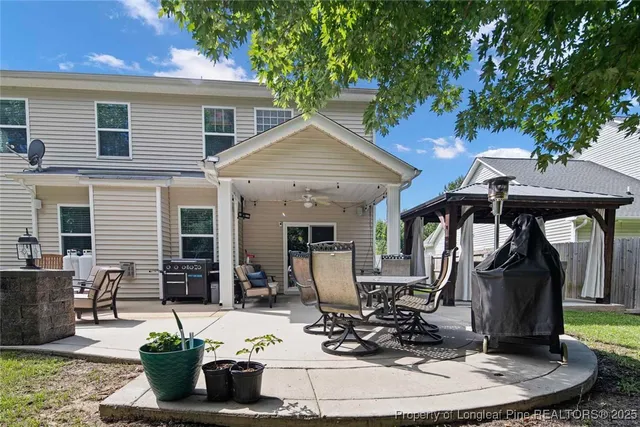 a view of a house with outdoor seating