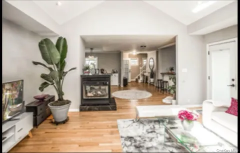a bedroom with furniture and a large window