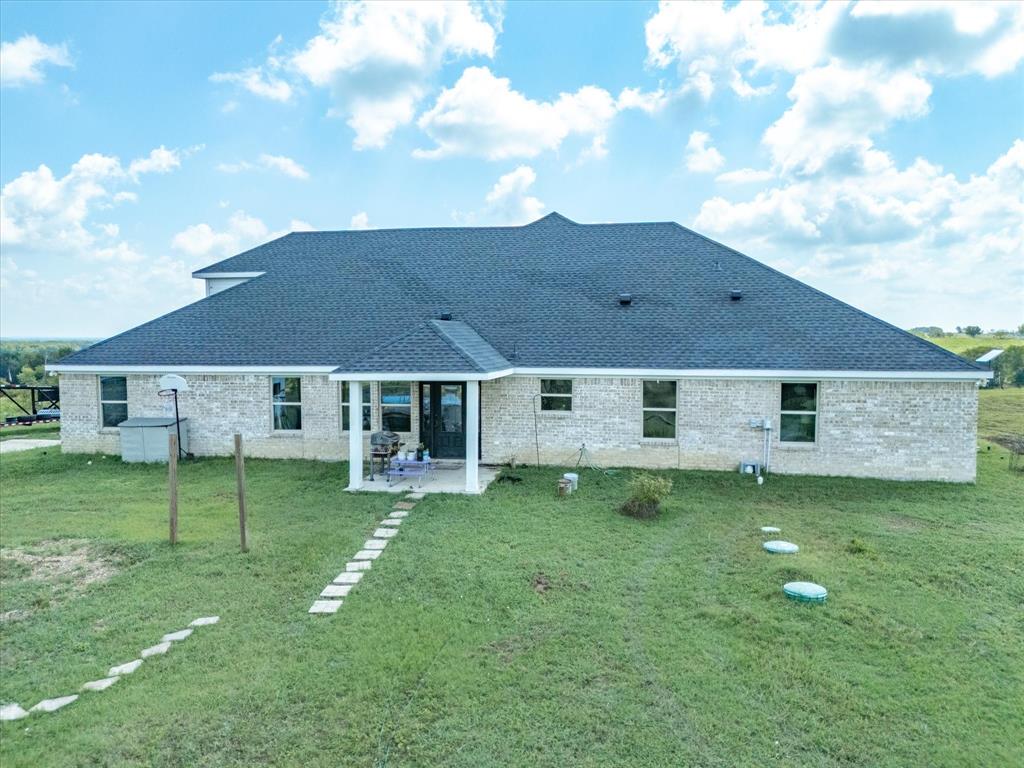 781 Alsdorf Road Ennis, TX 75119 - Photo 4 of 39 a house view with a garden space