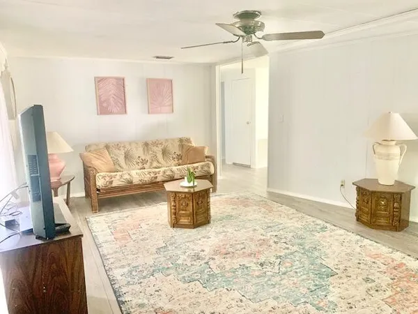a view of a livingroom with furniture and window