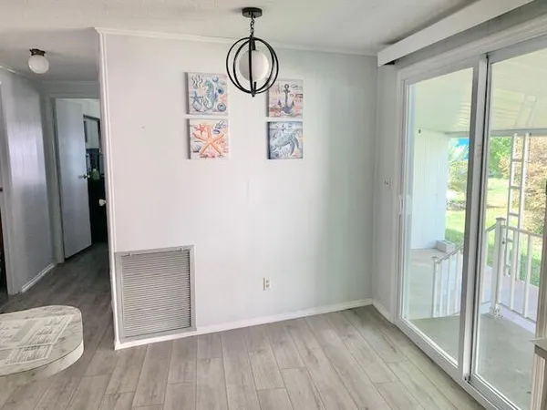 a dining room with furniture and windows