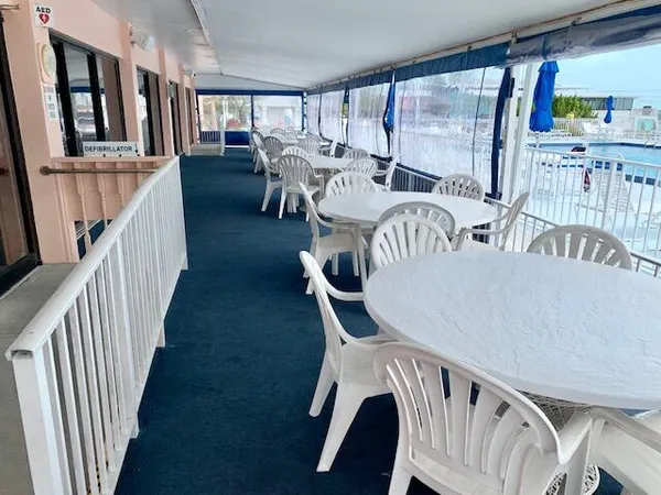 a view of a swimming pool with a table and chairs