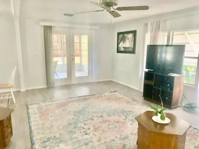 a view of a livingroom with furniture and window