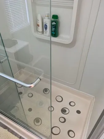 a bathroom with a tub and shower
