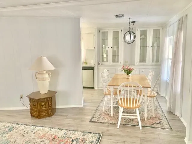 a view of a livingroom with furniture and wooden floor