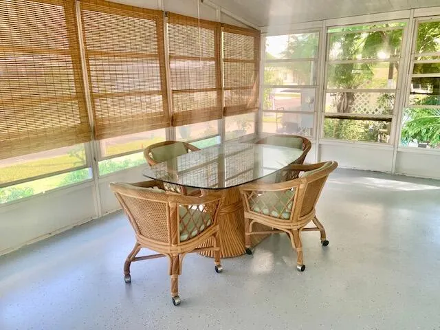 a dining room with furniture and windows