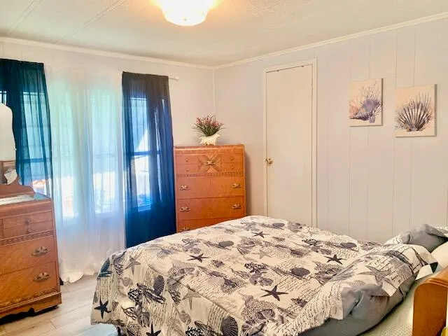 a bedroom with a bed and a cabinets
