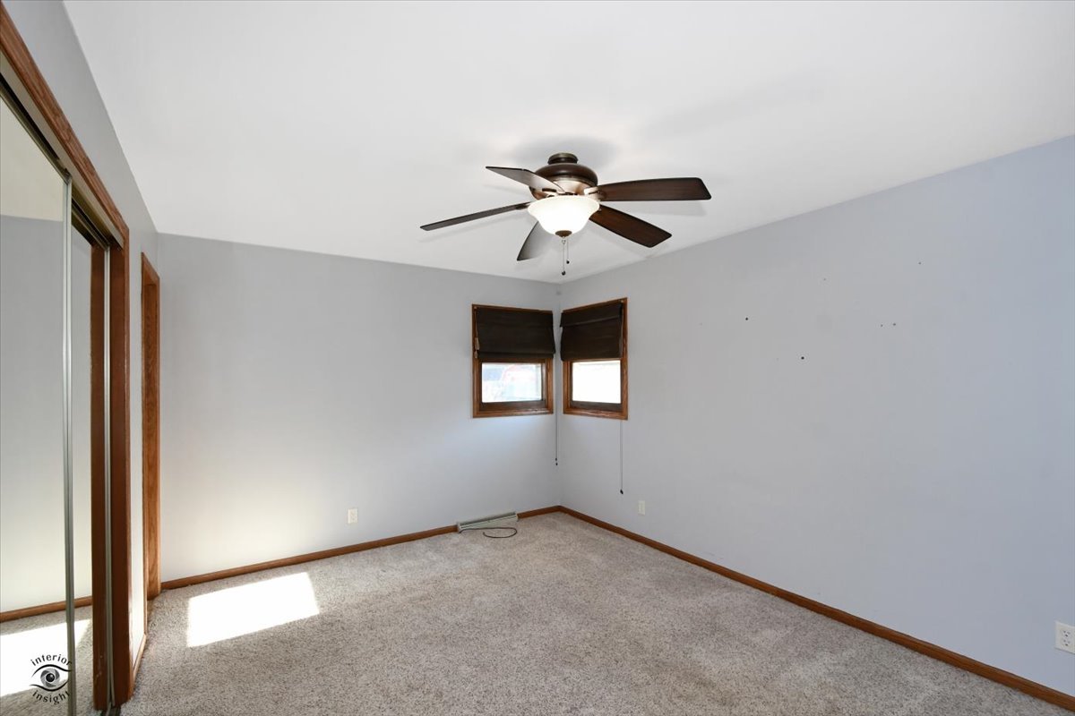 616 Northgate Road New Lenox, IL 60451 - Photo 15 of 34 an empty room with a window and a ceiling fan