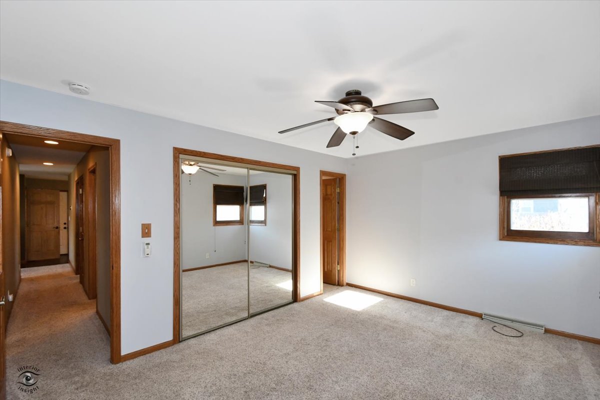 616 Northgate Road New Lenox, IL 60451 - Photo 16 of 34 an empty room that has a window and kitchen view