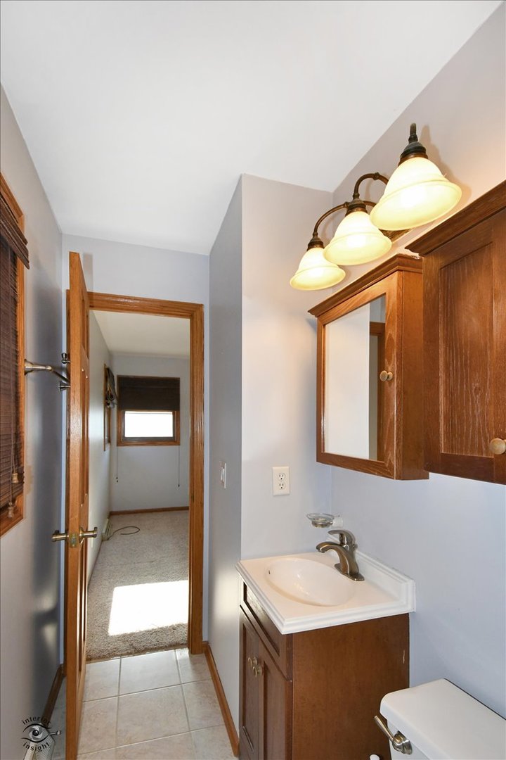 616 Northgate Road New Lenox, IL 60451 - Photo 19 of 34 a bathroom with a sink a toilet and mirror