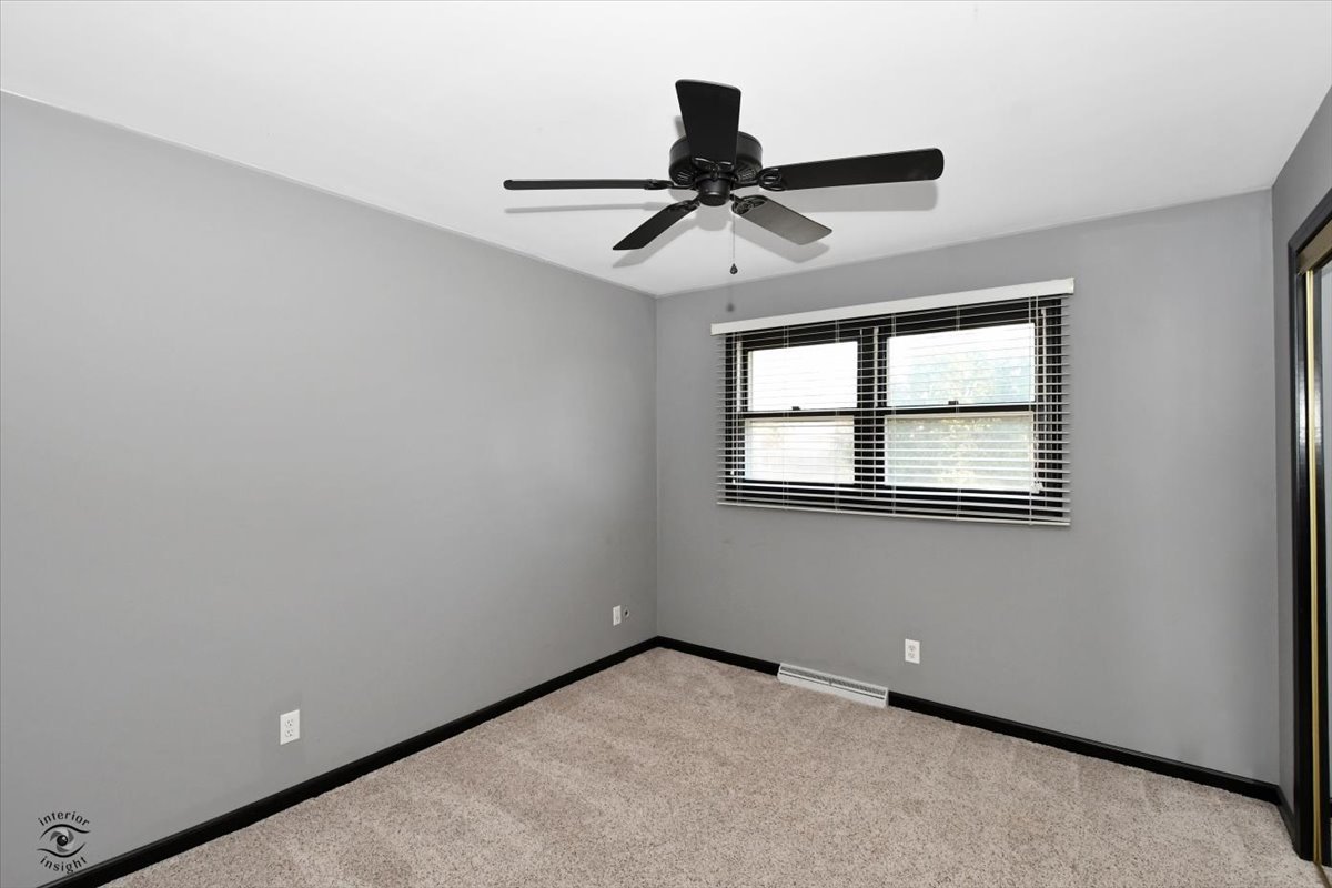 616 Northgate Road New Lenox, IL 60451 - Photo 21 of 34 an empty room with windows and fan