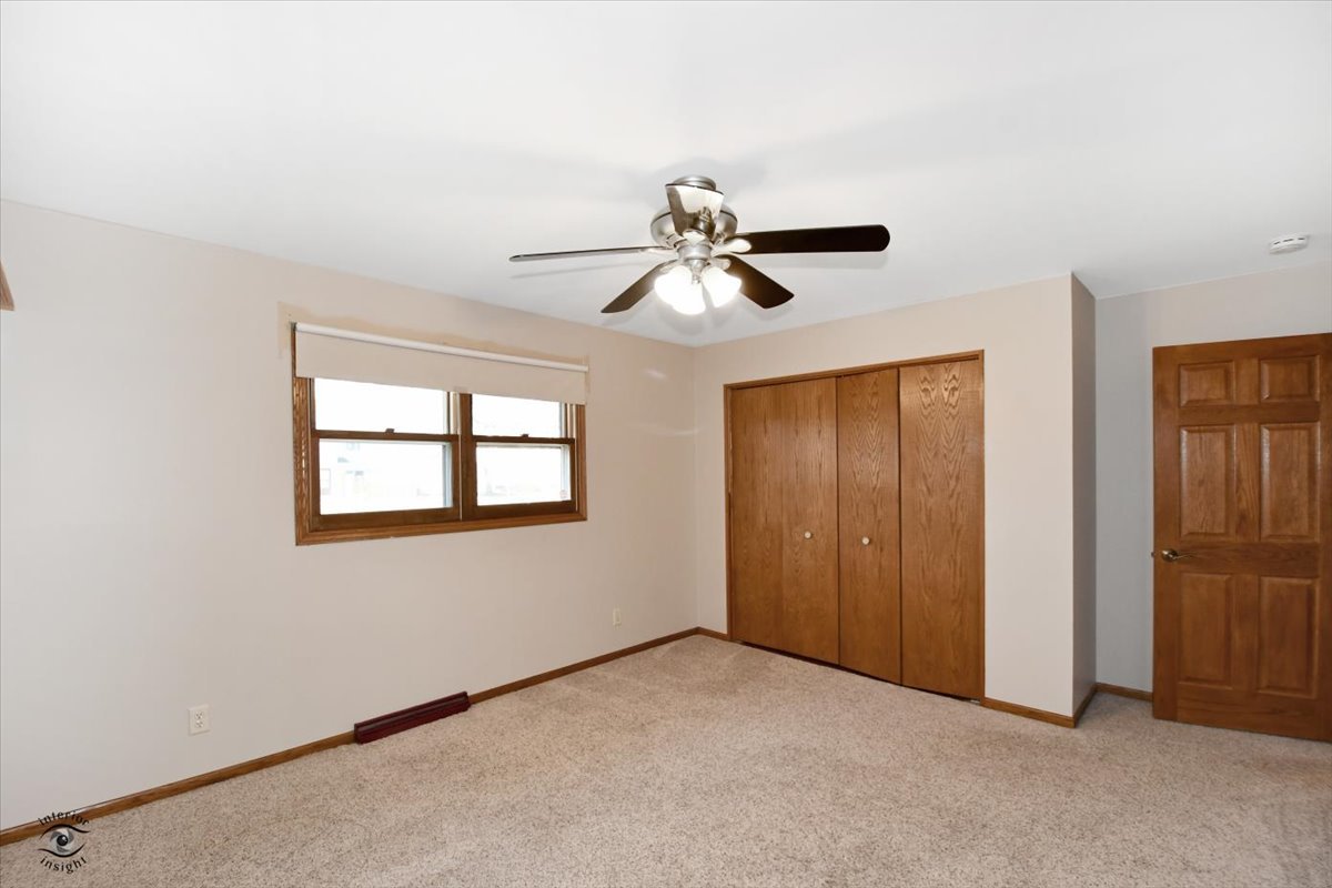 616 Northgate Road New Lenox, IL 60451 - Photo 22 of 34 an empty room with closet and windows