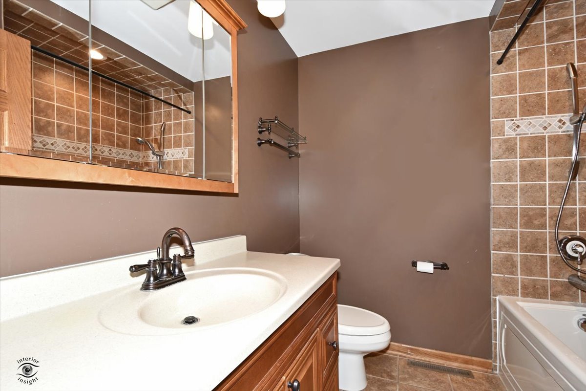 616 Northgate Road New Lenox, IL 60451 - Photo 23 of 34 a bathroom with a sink and a toilet