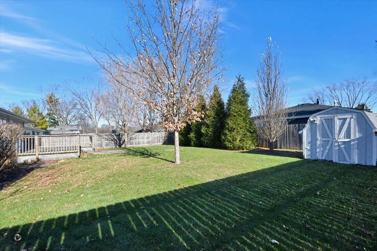 616 Northgate Road New Lenox, IL 60451 - Photo 6 of 34 a view of a backyard with large trees