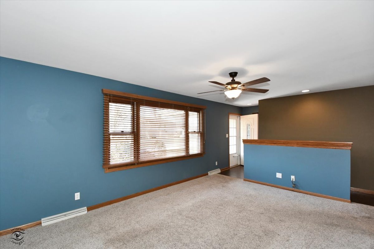 616 Northgate Road New Lenox, IL 60451 - Photo 10 of 34 a view of a livingroom with a ceiling fan and window