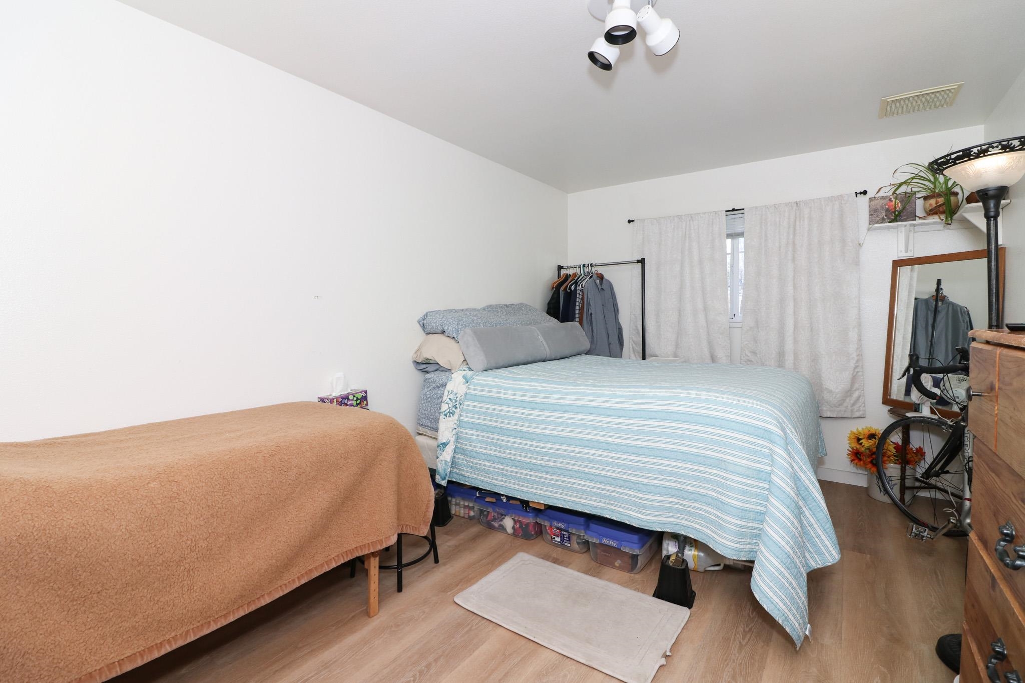 607-28 28 3/4 Road Grand Junction, CO 81506 - Photo 32 of 42 a bedroom with a bed and a chandelier