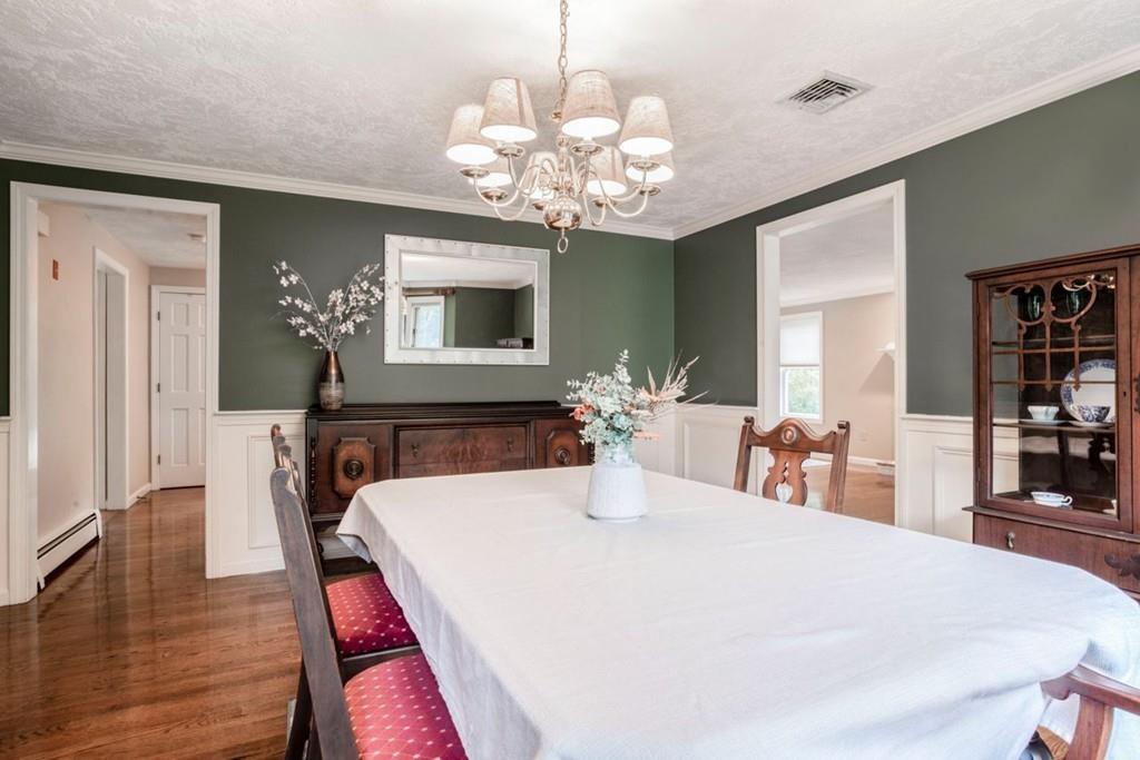 89 Shadow Oak Drive Sudbury, MA 01776 - Photo 11 of 31 a view of a dining room with furniture and chandelier
