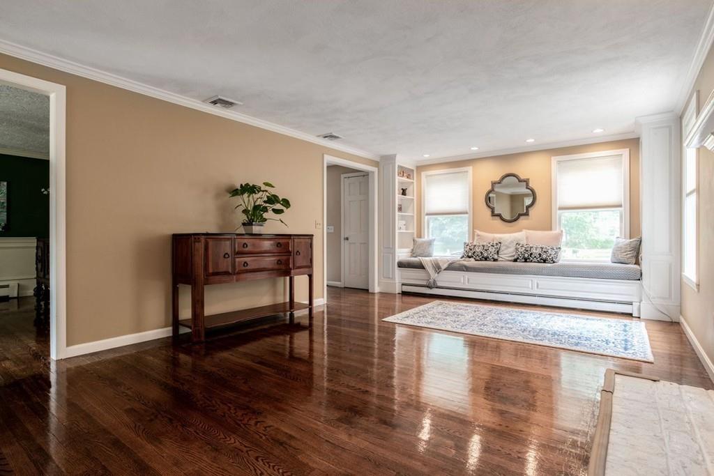 89 Shadow Oak Drive Sudbury, MA 01776 - Photo 13 of 31 a living room with furniture and a wooden floor
