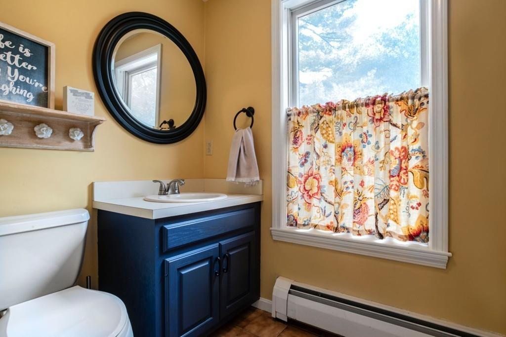 89 Shadow Oak Drive Sudbury, MA 01776 - Photo 17 of 31 a bathroom with a toilet a sink and a mirror