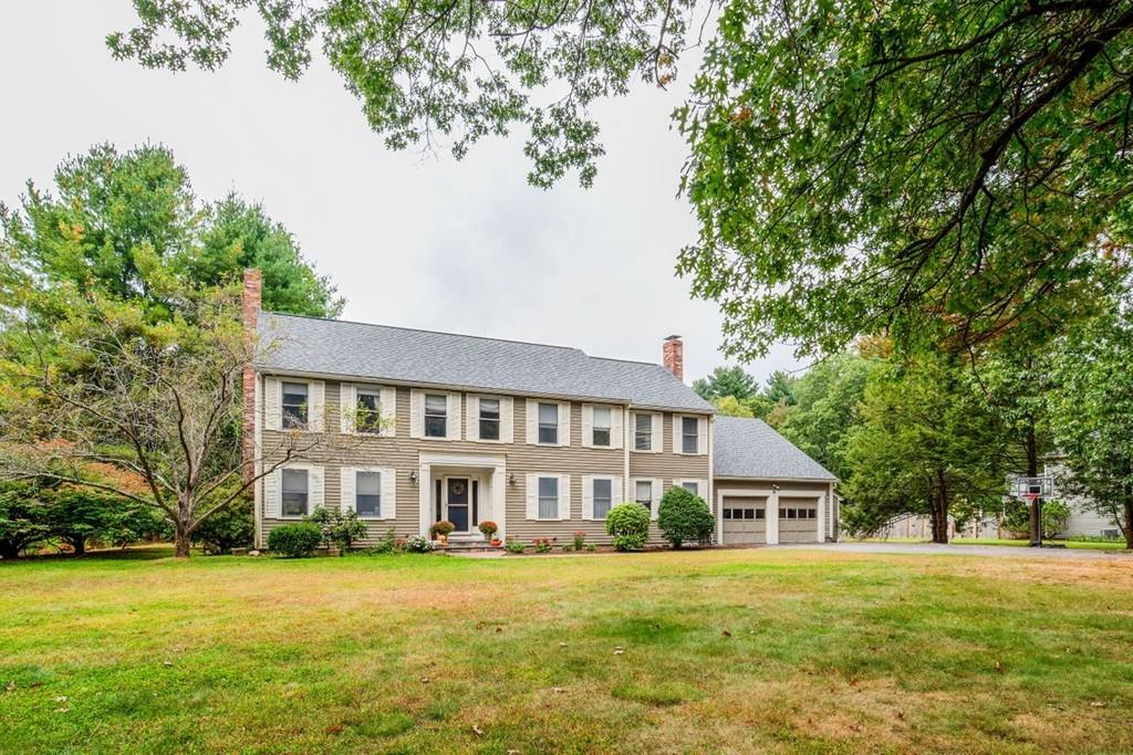89 Shadow Oak Drive Sudbury, MA 01776 - Photo 2 of 31 a front view of a house with a garden