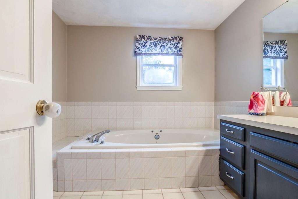 89 Shadow Oak Drive Sudbury, MA 01776 - Photo 21 of 31 a bathroom with a bathtub and a sink