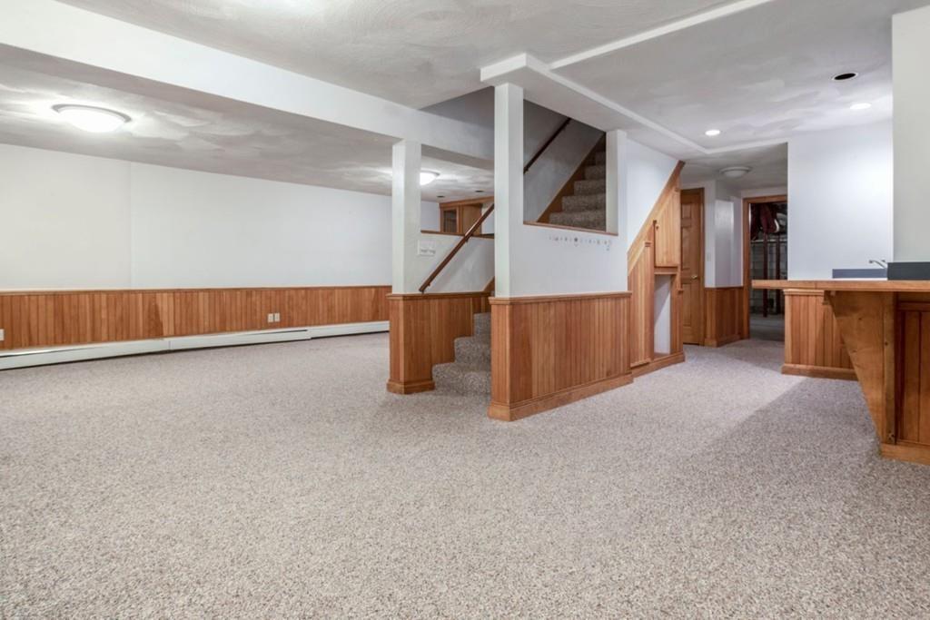 89 Shadow Oak Drive Sudbury, MA 01776 - Photo 24 of 31 a view of an empty room with wooden floor