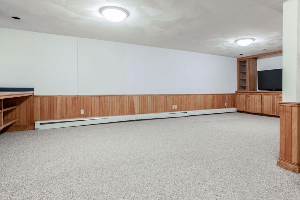 89 Shadow Oak Drive Sudbury, MA 01776 - Photo 25 of 31 a view of room with window and tv