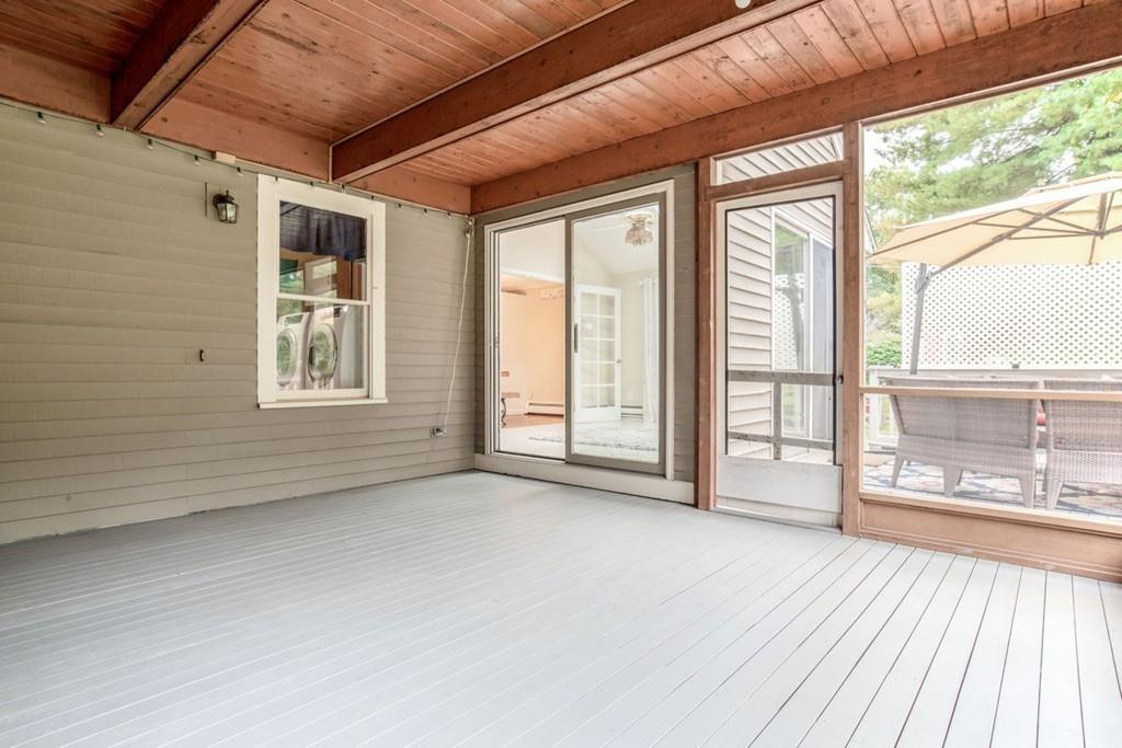 89 Shadow Oak Drive Sudbury, MA 01776 - Photo 26 of 31 a view of an empty room with a window and a balcony