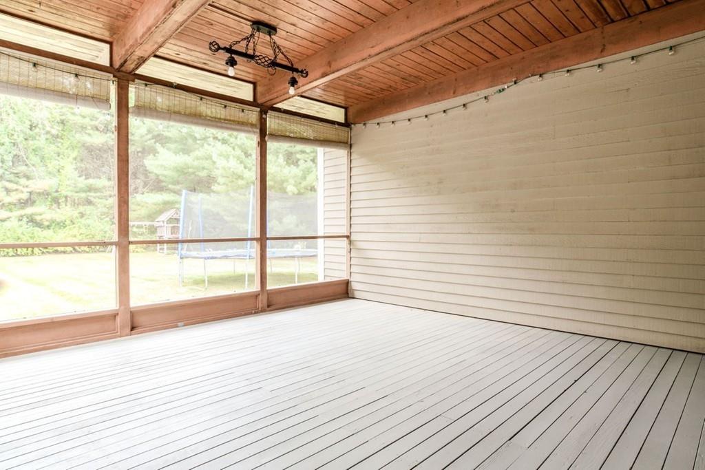89 Shadow Oak Drive Sudbury, MA 01776 - Photo 27 of 31 a view of an empty room with wooden floor and a window